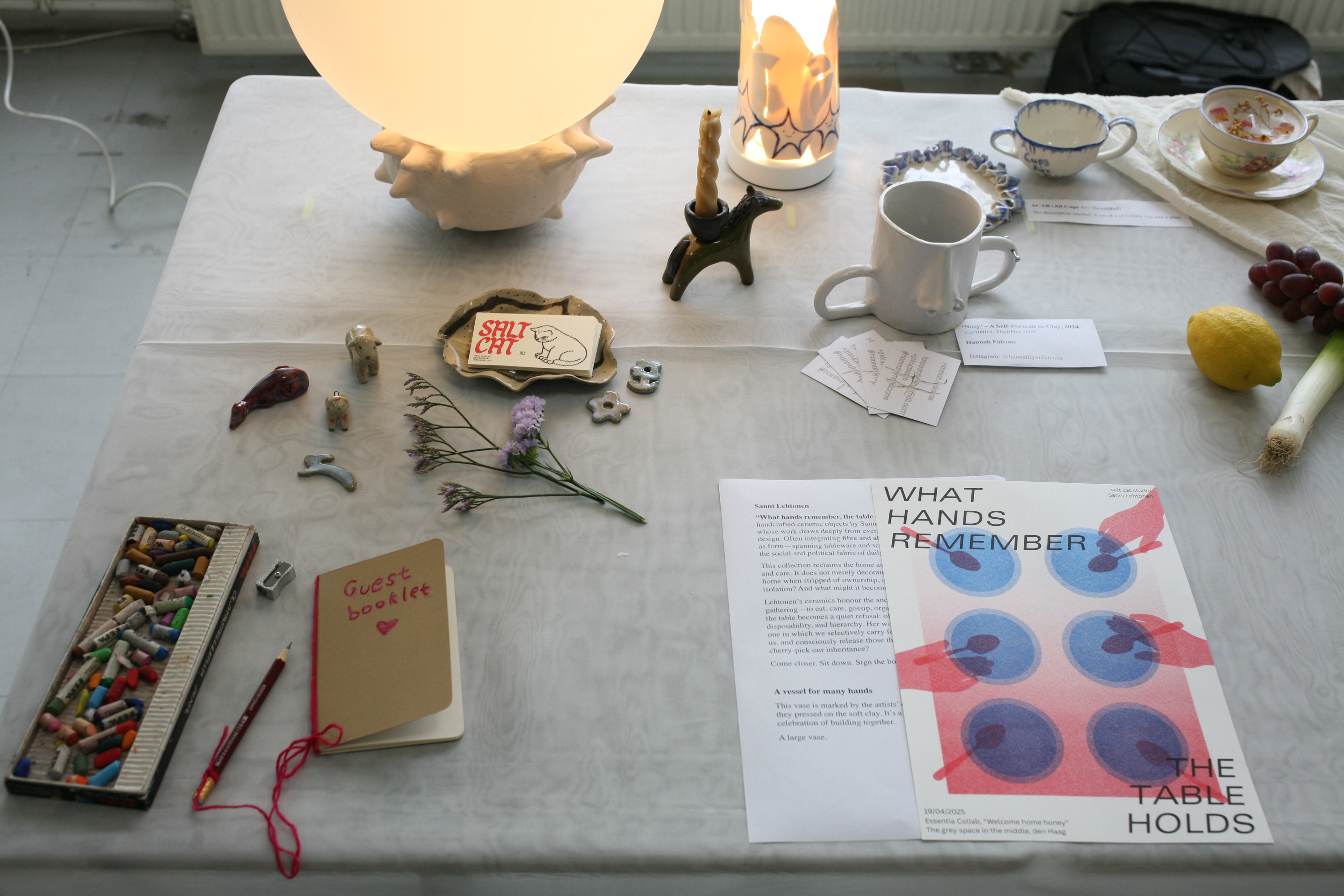 Table installation with ceramic vessels and textiles